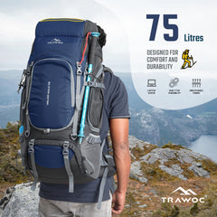Person wearing the VALOR MAX-75 Rucksack in navy blue, demonstrating its ergonomic design and comfortable fit with adjustable straps, set against a natural outdoor setting, showcasing the rucksack's spacious compartments and practical features ideal for hiking and travel.