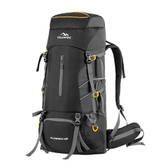Person showcasing the FLYSPECK-65 Rucksack in black, featuring a sleek design and durable material. The rucksack is displayed in an outdoor environment, emphasizing its ample storage space and functional pockets, ideal for outdoor activities and everyday use.